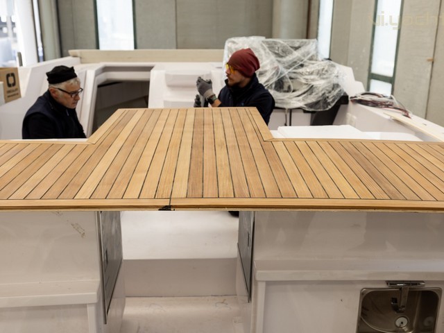 Natural Teak on upper deck with table furniture upholstery